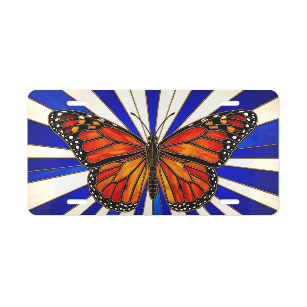 monarch butterfly vanity plate — burnt orange black wings on bold blue cream rays license plate