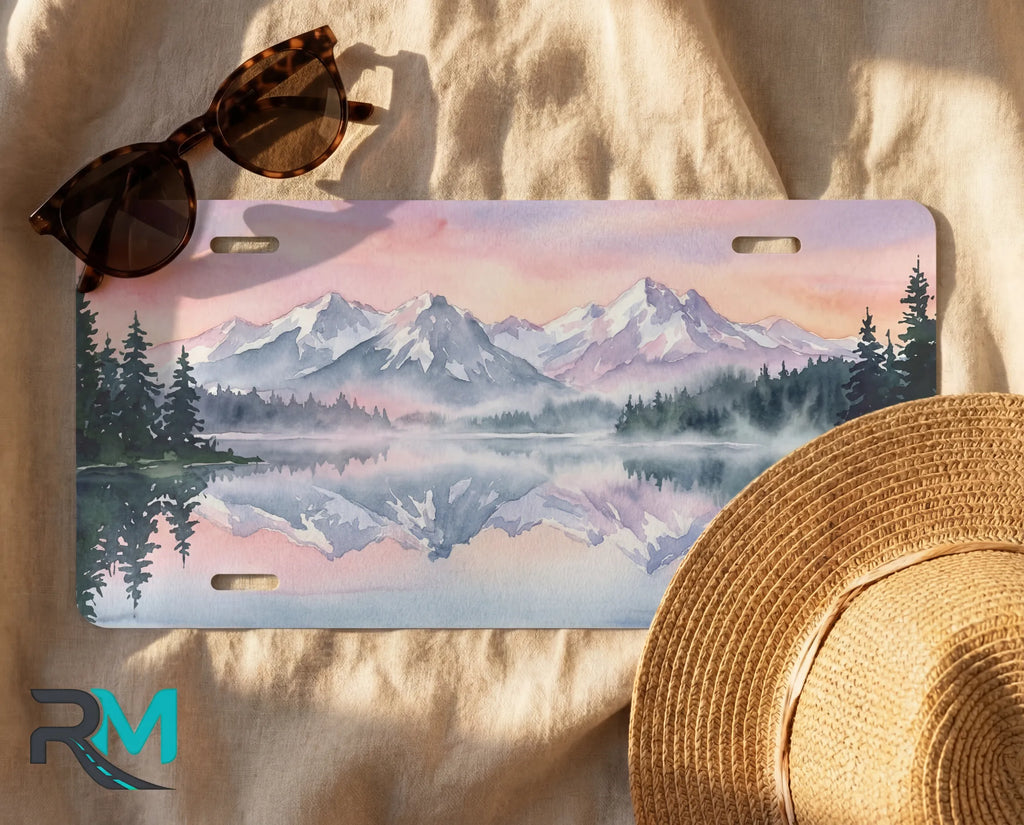 decorative mountain lake license plate flat lay — soft lavender pink alpine front license plate