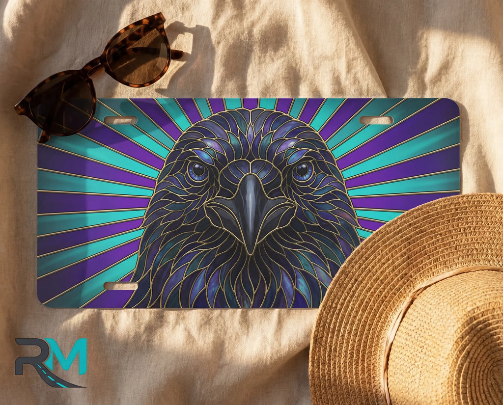 raven vanity plate flat lay — deep blue purple teal radiant rays front license plate