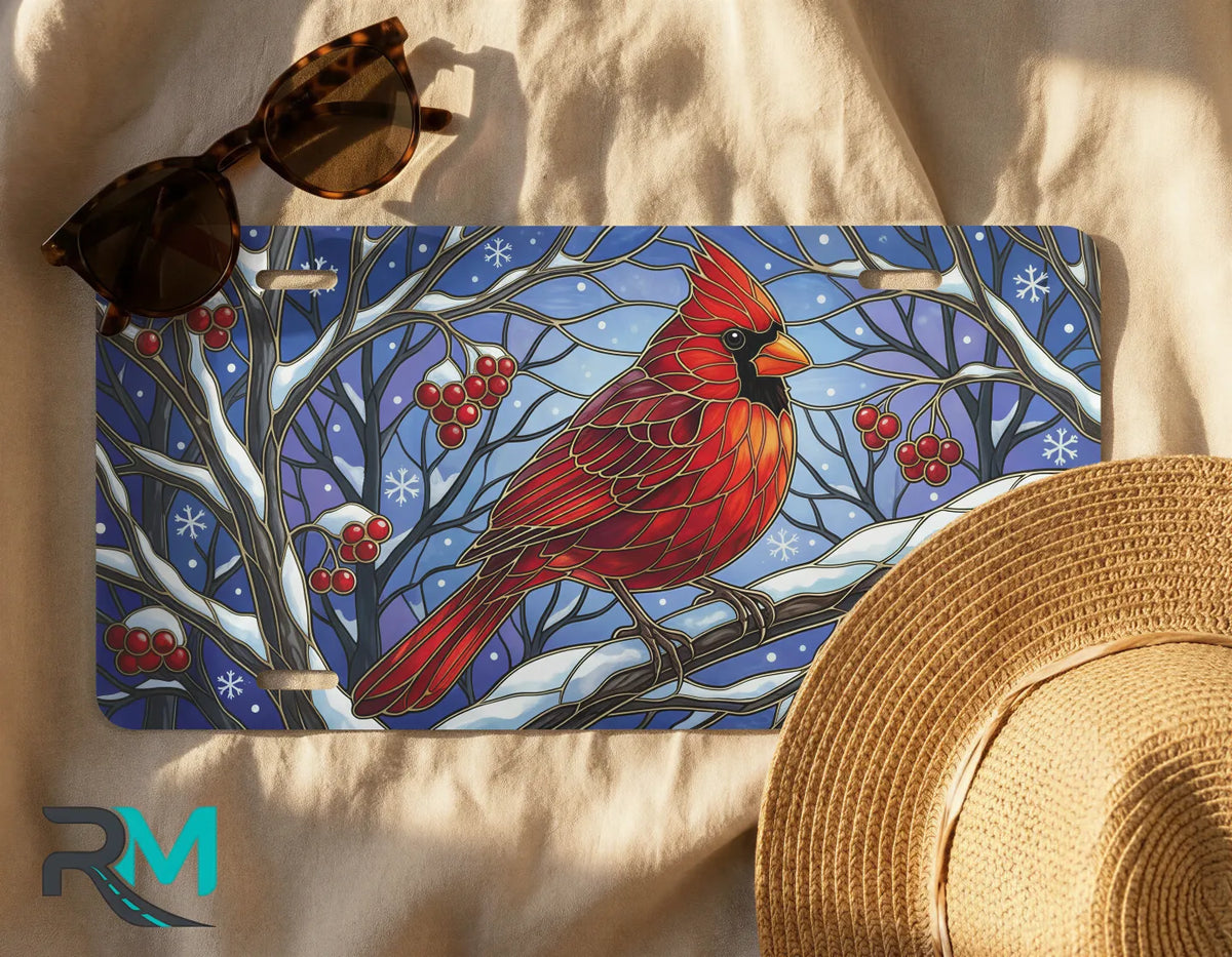 cardinal winter license plate flat lay — vivid scarlet red bird snowy branch front license plate