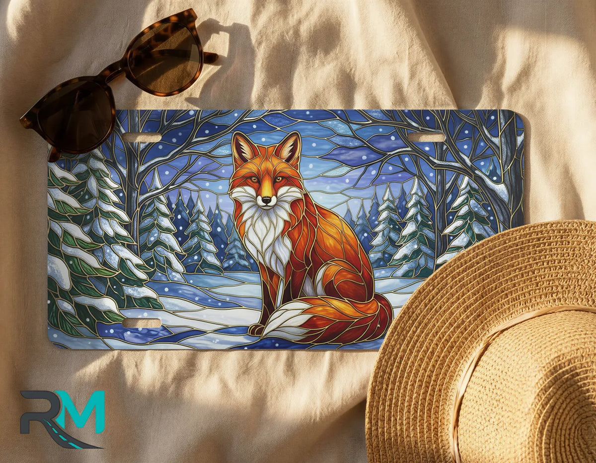 snowy fox license plate flat lay — warm amber fox winter forest front license plate