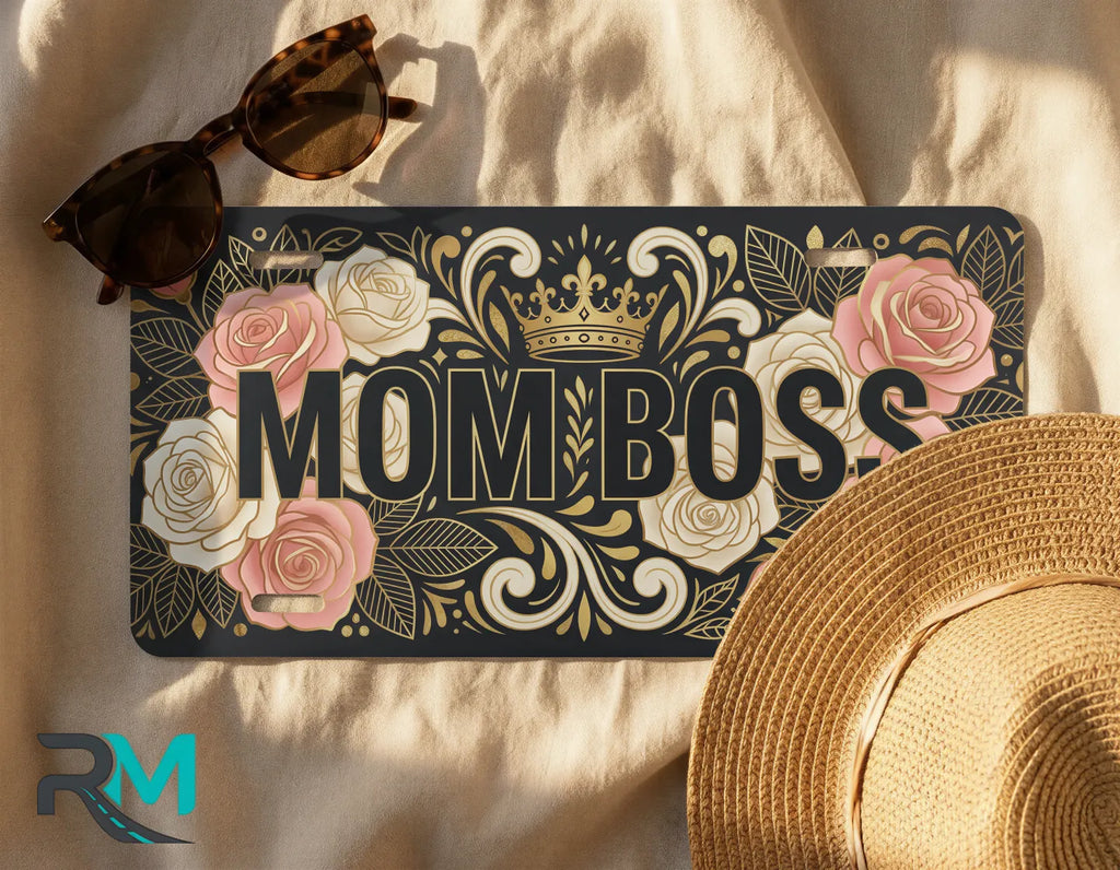 mom boss license plate flat lay — blush rose gold scrollwork front license plate