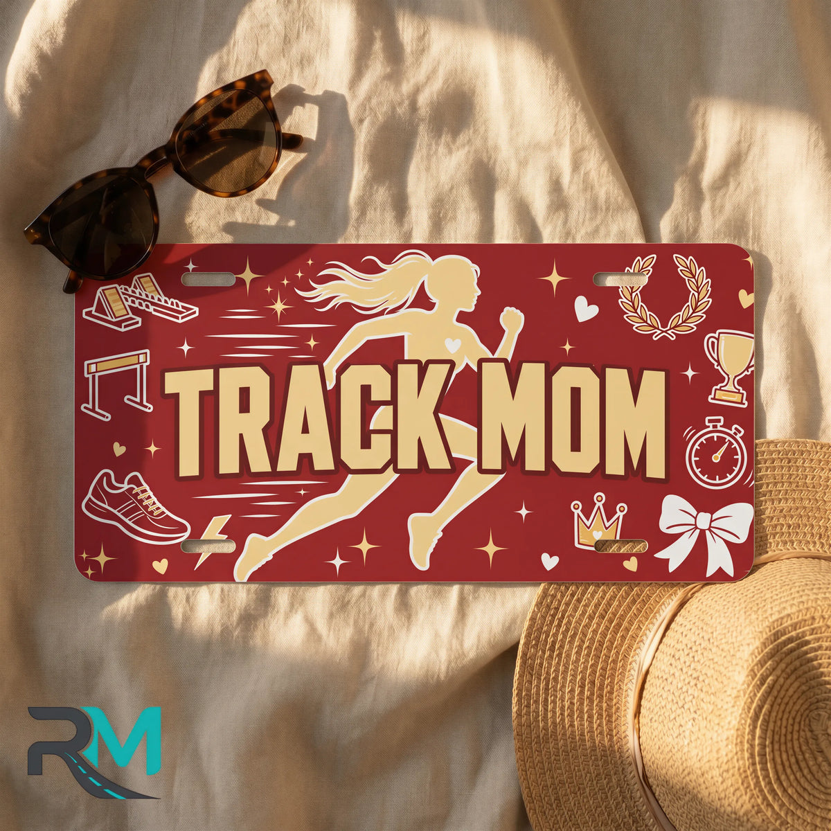 track mom license plate flat lay — runner silhouette spikes trophy front plate