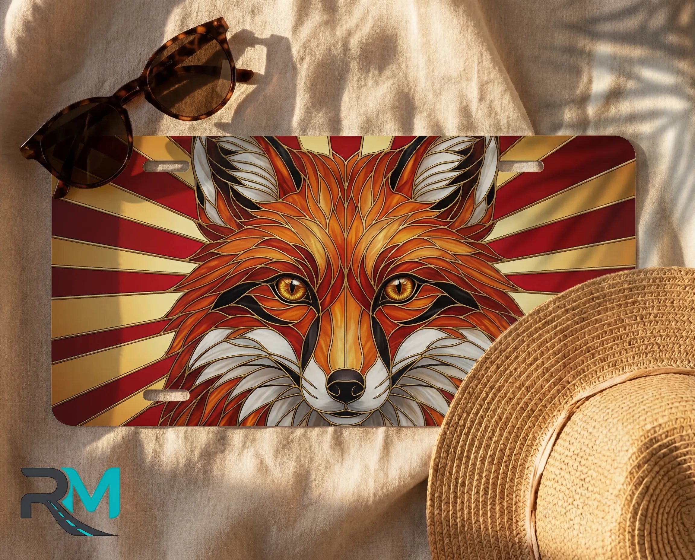 red fox vanity plate flat lay — warm red amber gold fox sunburst front license plate