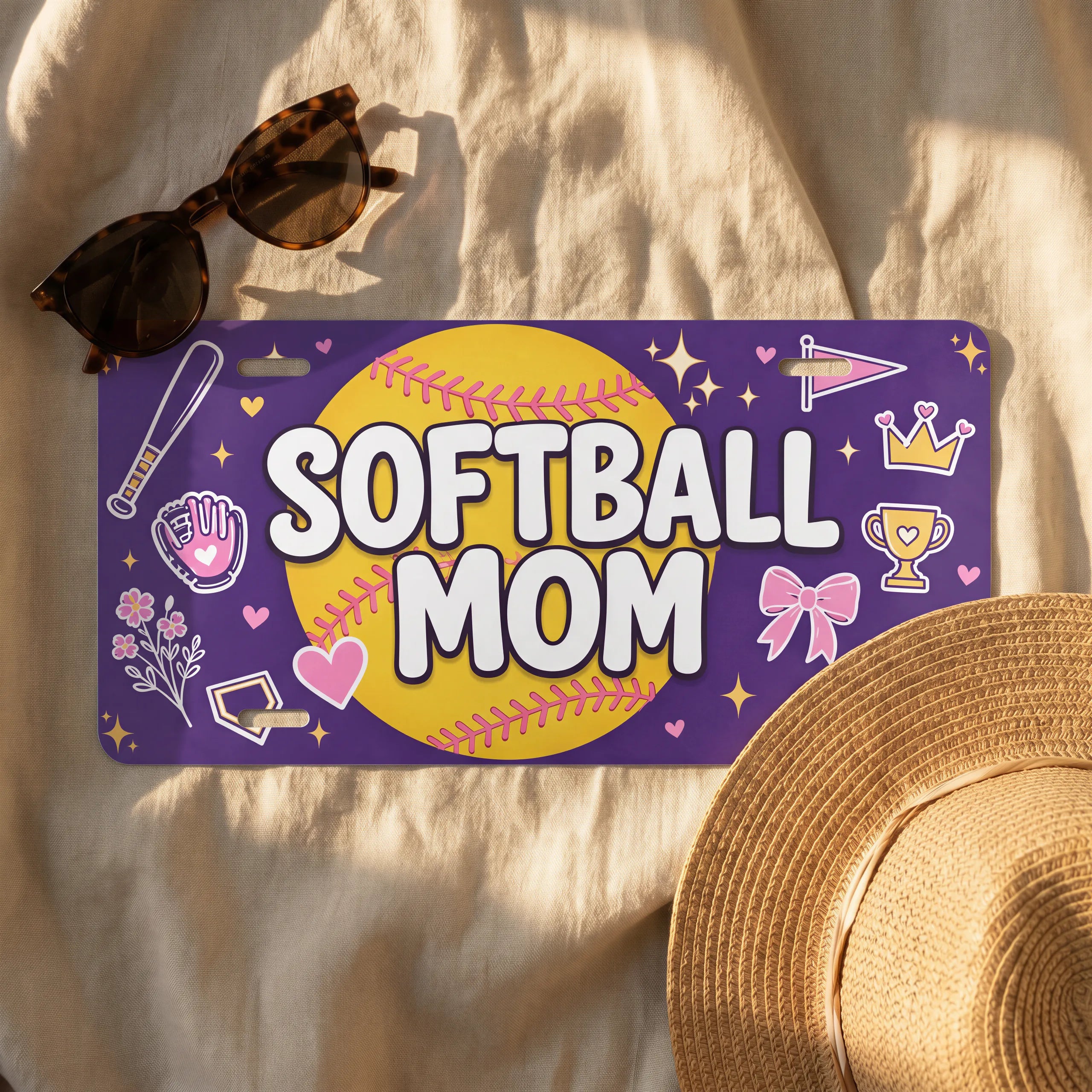 softball mom license plate flat lay — rich purple softball bat glove trophy front plate
