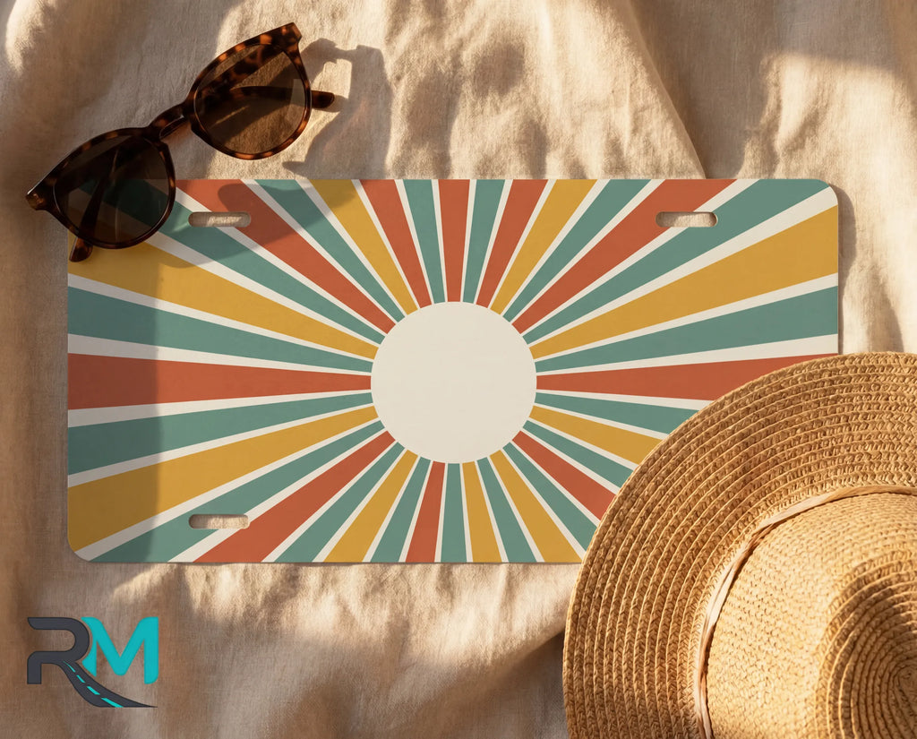 vintage sunburst license plate flat lay — rust sage mustard cream retro front license plate