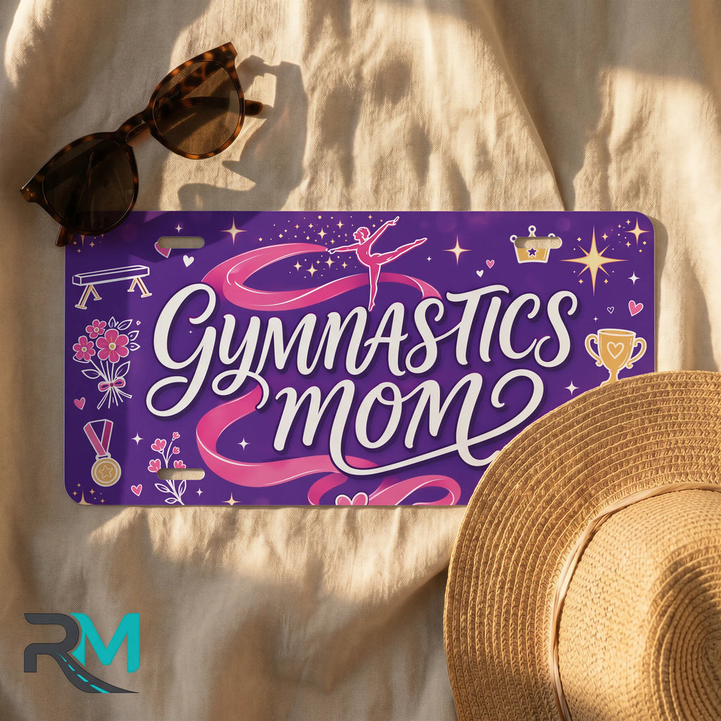 gymnastics mom license plate flat lay — purple pink ribbon trophy front plate