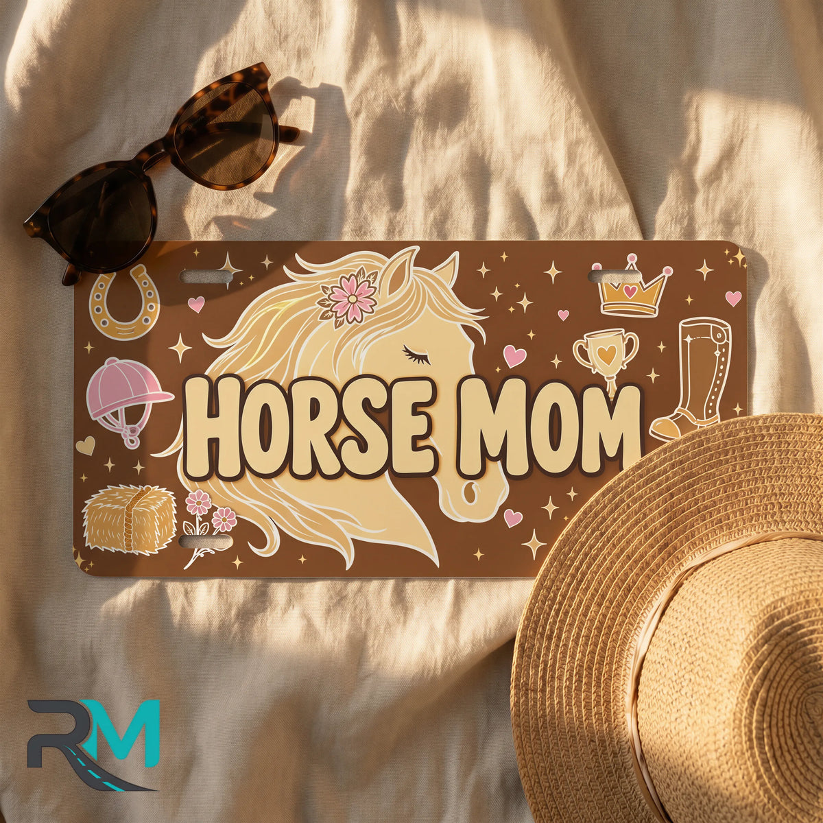 horse mom license plate flat lay — warm brown cream blush horseshoe boot front plate