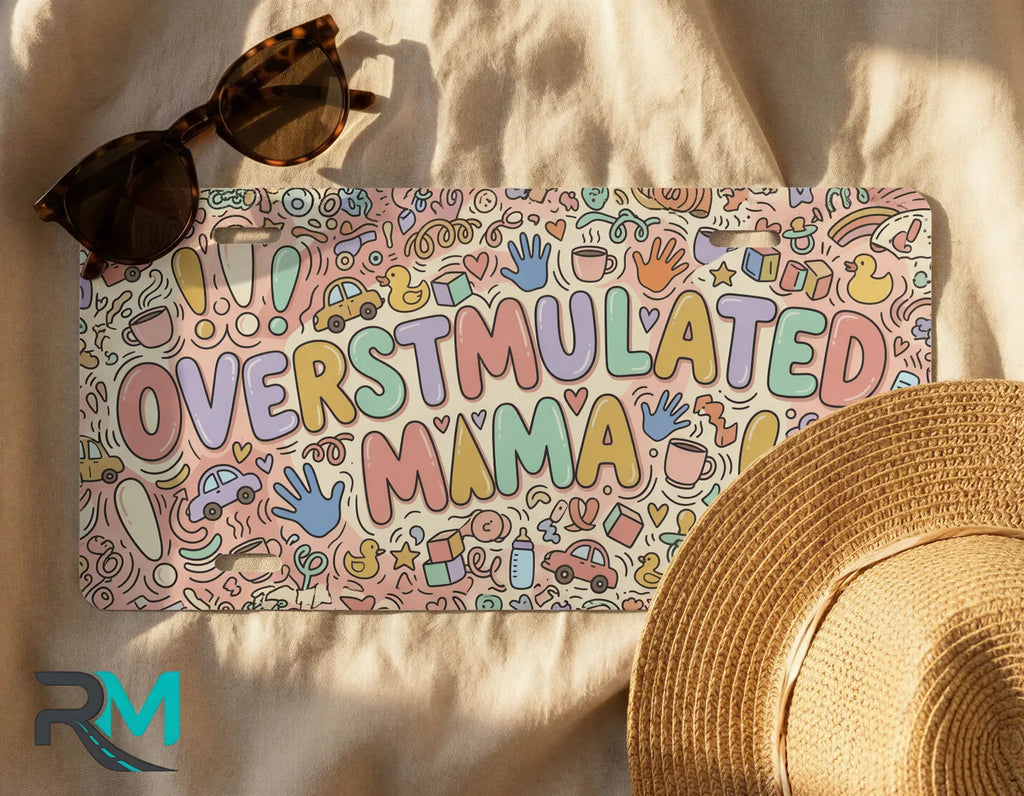 overstimulated mama license plate flat lay — colorful pastel doodle front license plate