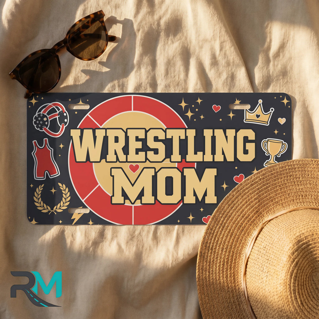 wrestling mom license plate flat lay — red gold headgear trophy front plate