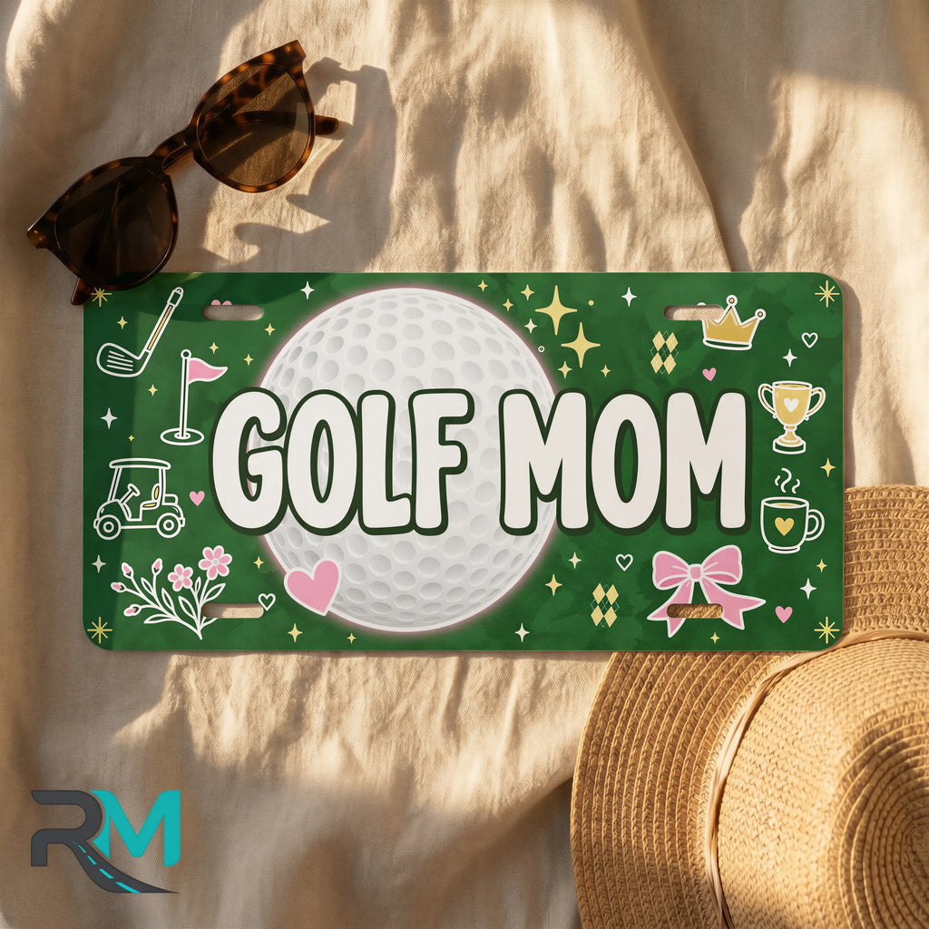 golf mom license plate flat lay — deep green golf ball trophy front license plate