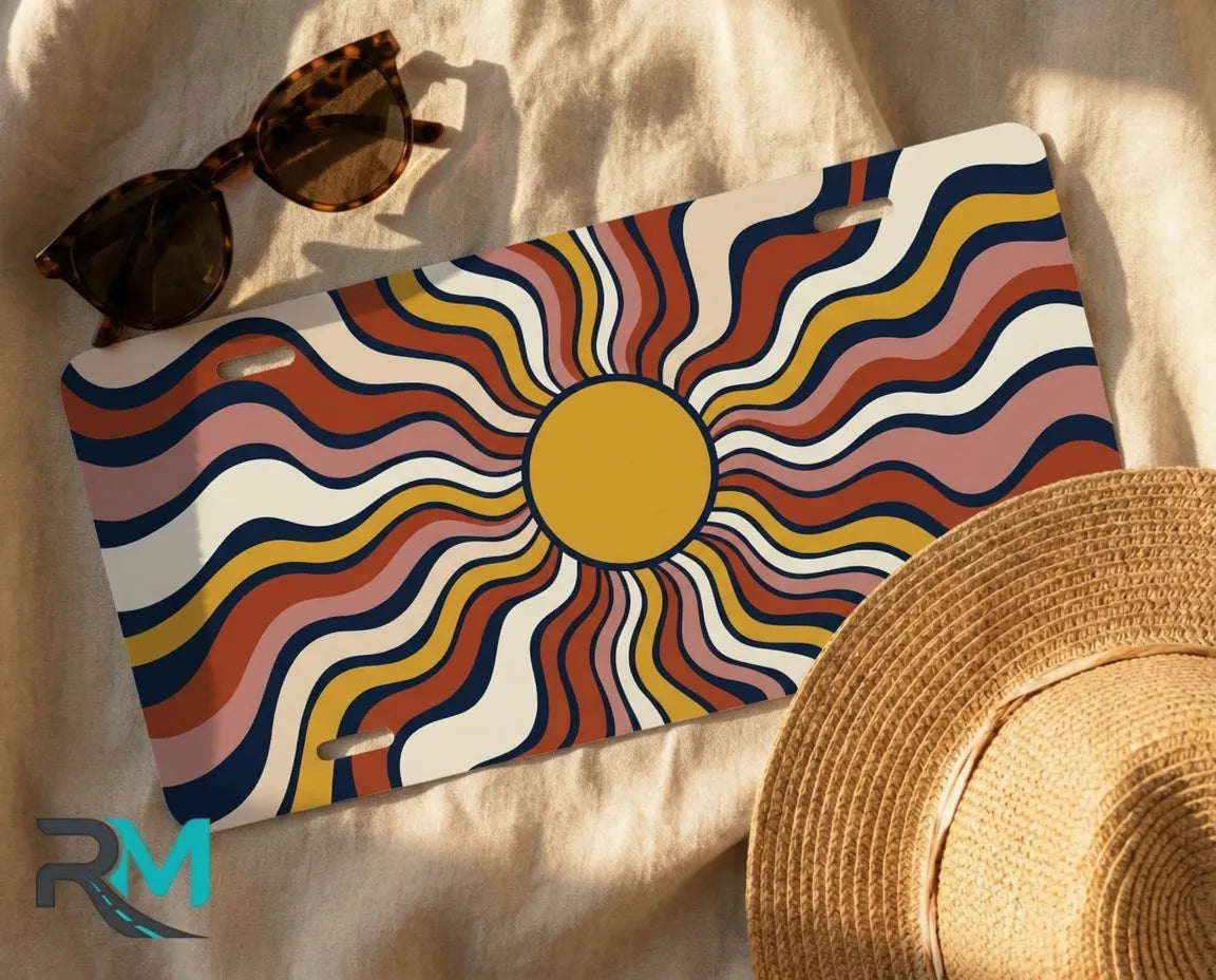boho sun license plate flat lay — burnt orange mustard navy front license plate art
