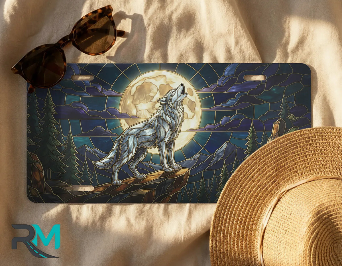 wolf moon license plate flat lay — midnight blue gold stained glass wolf front license plate
