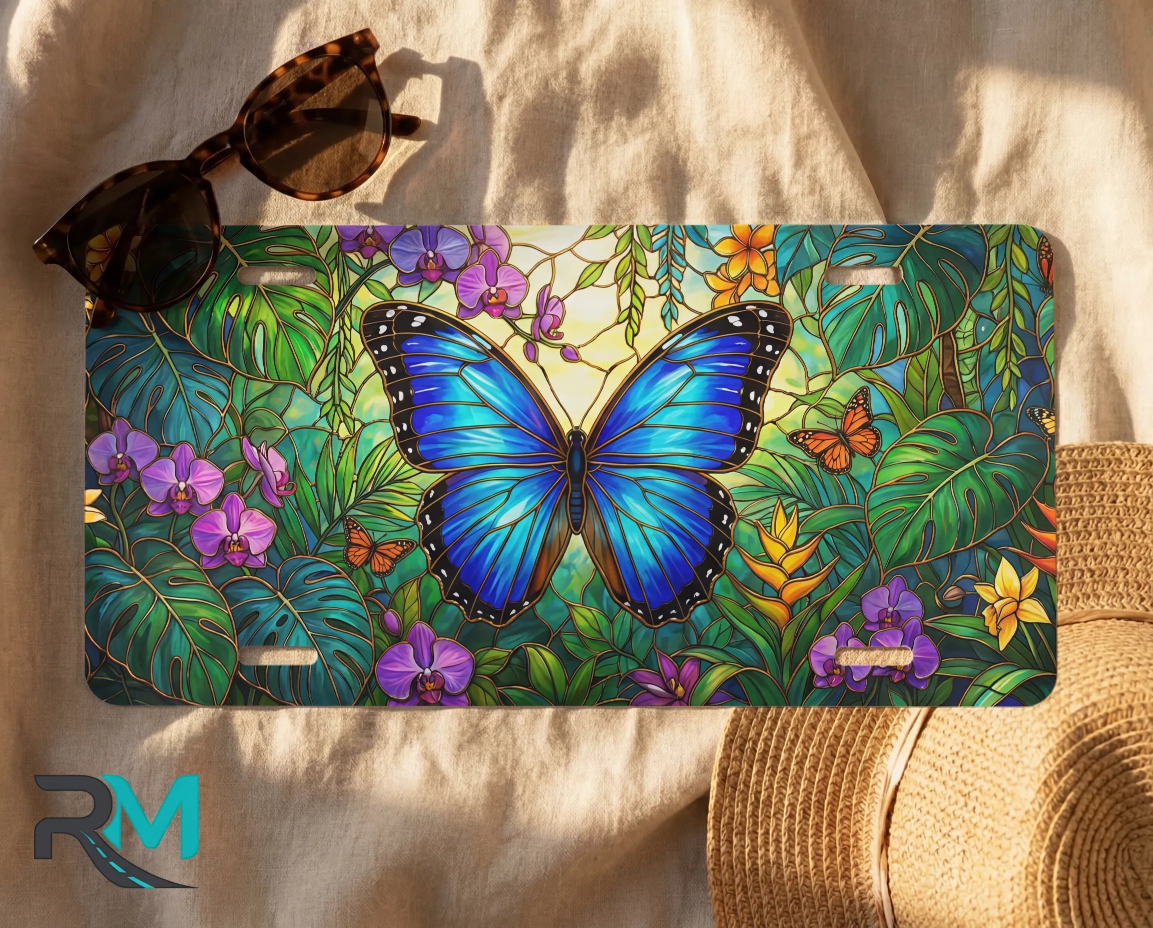 blue butterfly license plate flat lay — vivid sapphire blue butterfly tropical foliage front plate