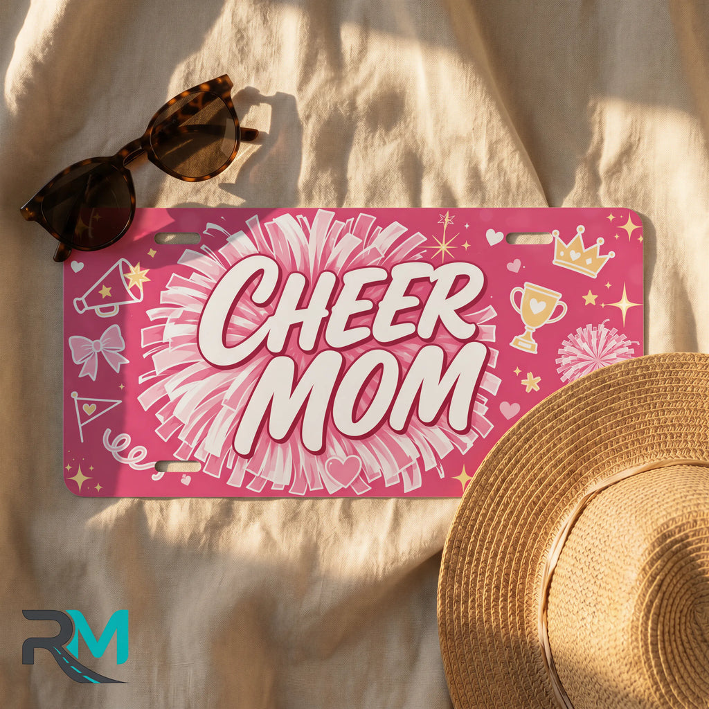 cheer mom license plate flat lay — hot pink pom-pom bow trophy front plate