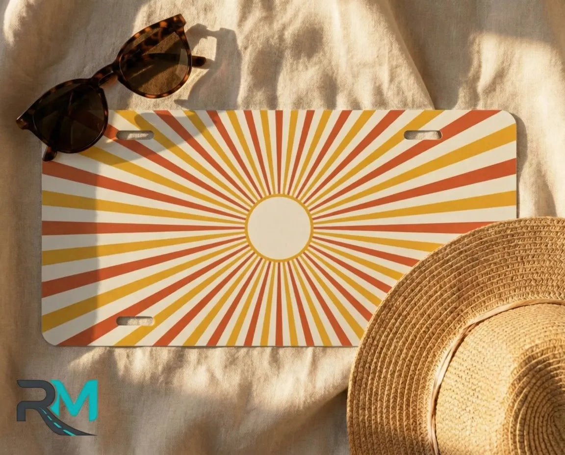 bright orange sunburst license plate flat lay — golden peach cream front license plate