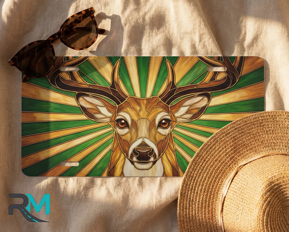 deer wildlife license plate flat lay — stag amber green sunburst front license plate
