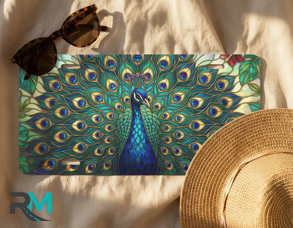 peacock feathers license plate flat lay — jewel teal emerald gold iridescent front license plate