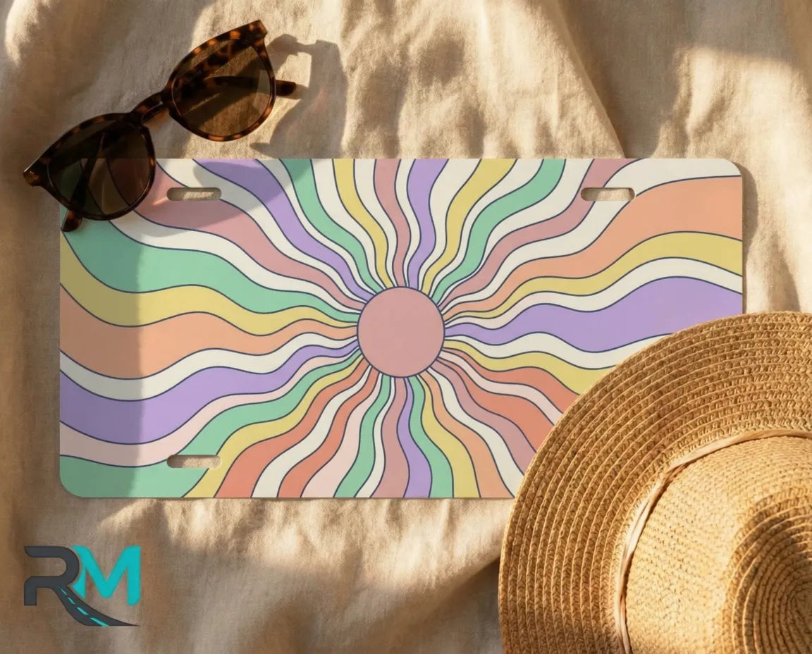 retro pastel rainbow license plate flat lay — candy swirl sunburst front license plate