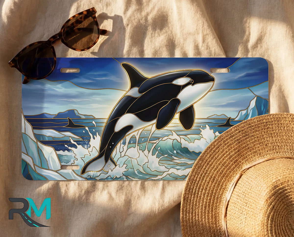 orca whale license plate flat lay — vivid orca black white icy blue ocean front plate