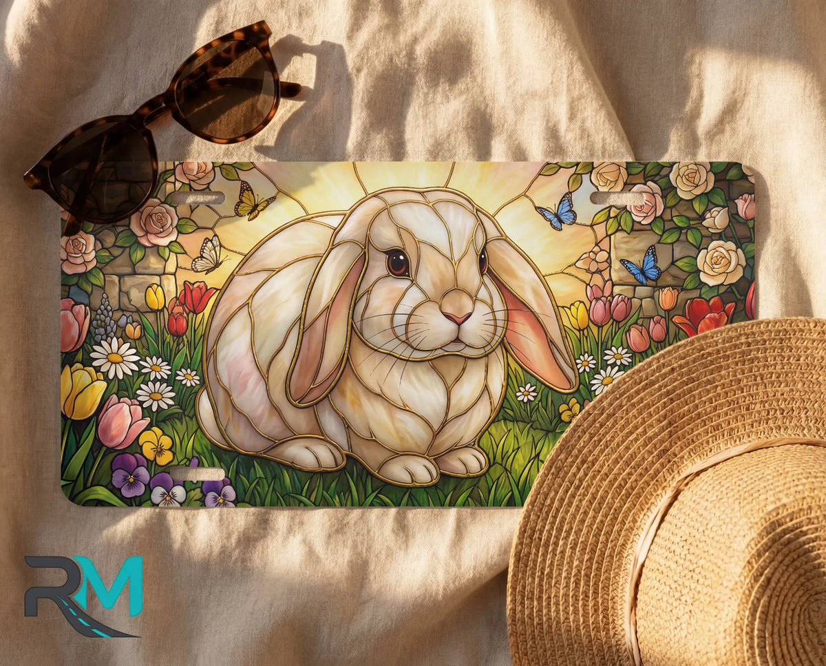 stained glass bunny license plate flat lay — soft pastel rabbit tulip rose butterfly front plate
