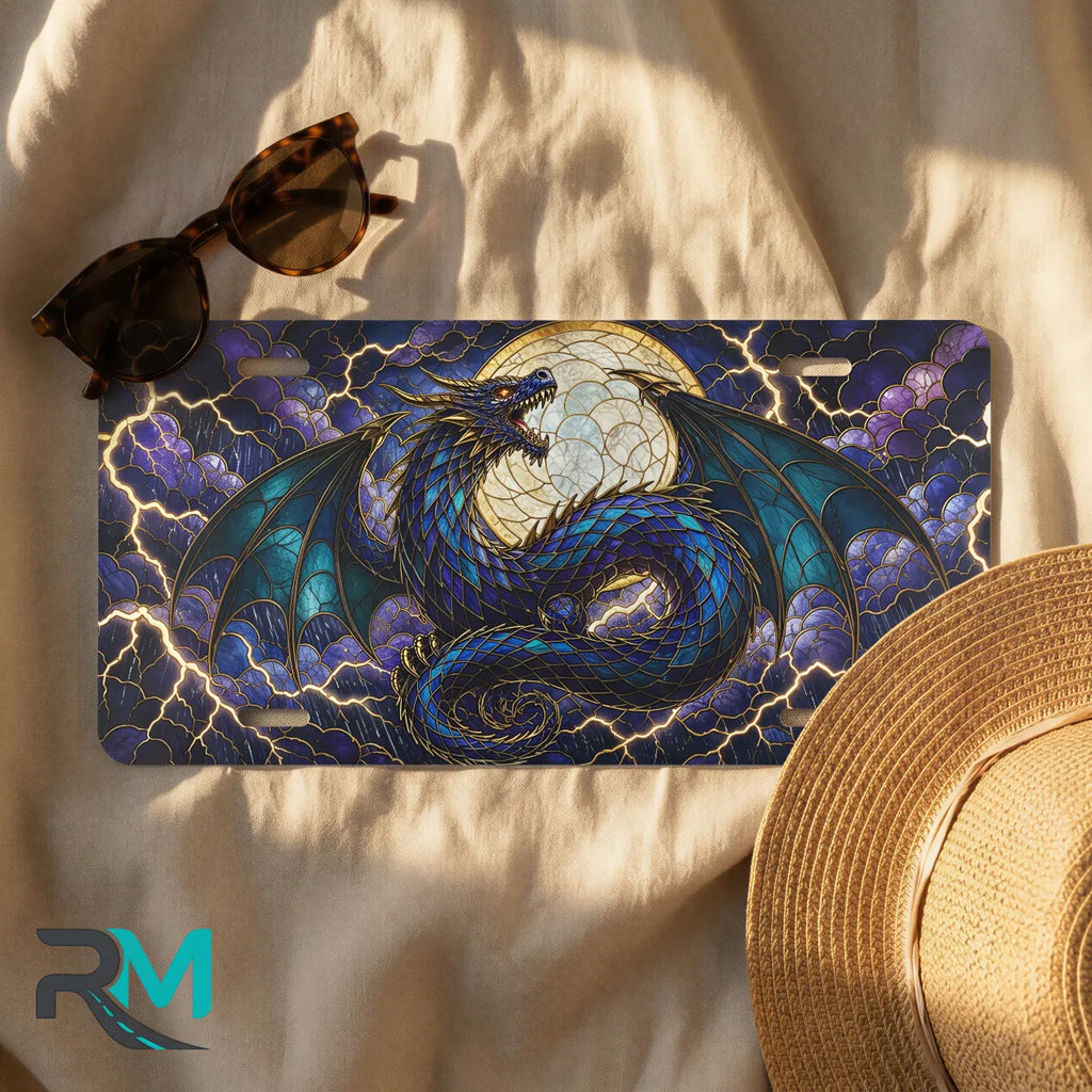 blue dragon license plate flat lay — jewel blue teal coiled dragon moon lightning front plate