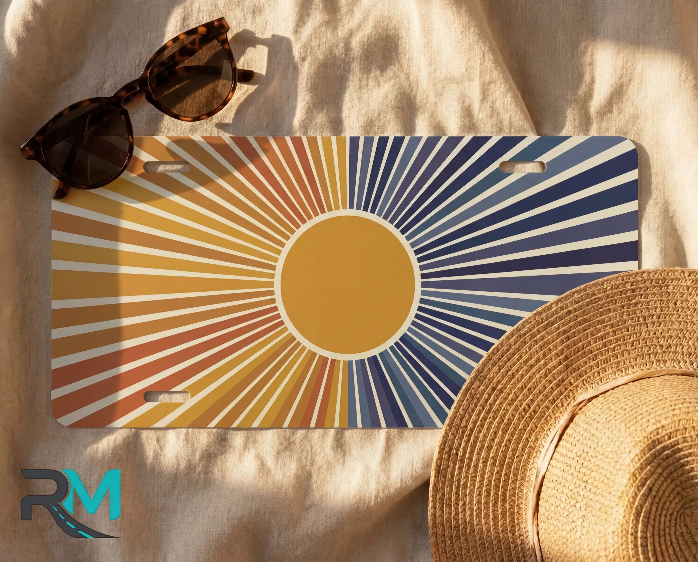 retro sunburst indigo license plate flat lay — warm amber peach deep blue front license plate