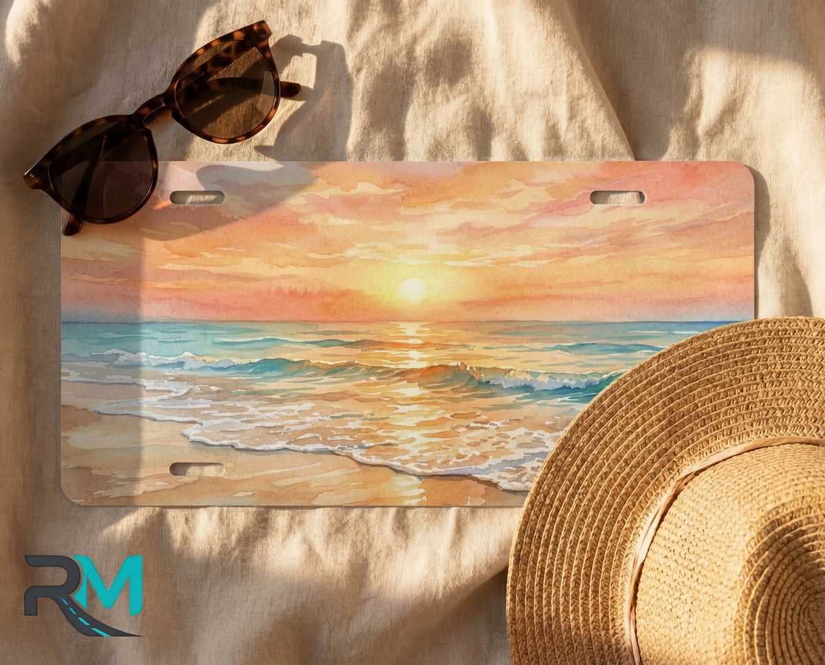 decorative beach license plate flat lay — painterly sunrise shoreline front license plate