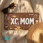 xc mom license plate flat lay — earthy sunrise trail stopwatch front plate