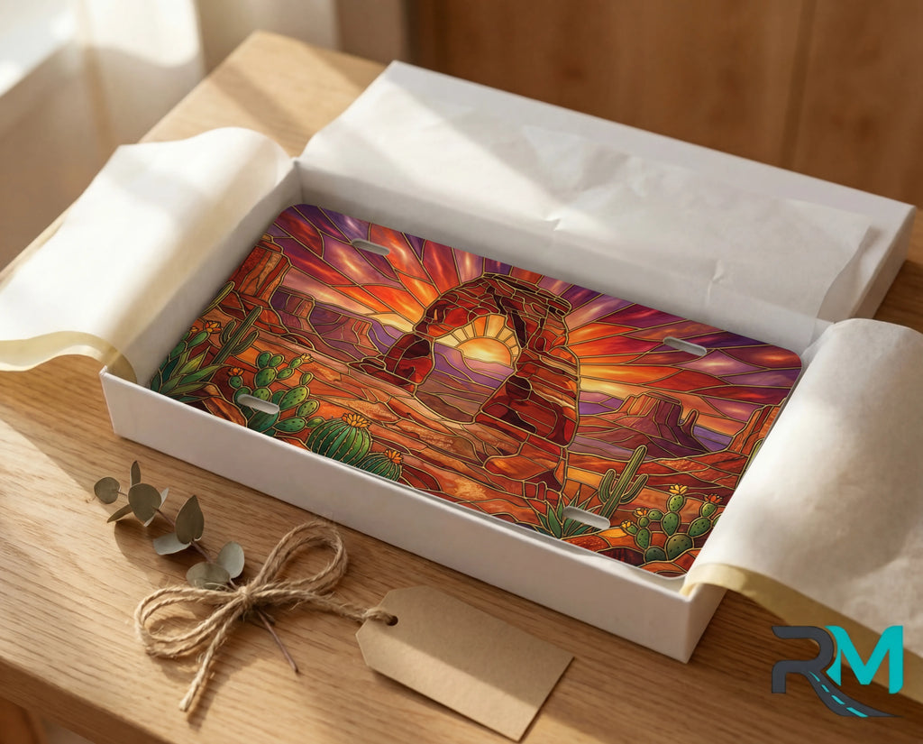 desert arch sunset vanity plate as gift — warm amber sandstone arch cactus license plate ready to give