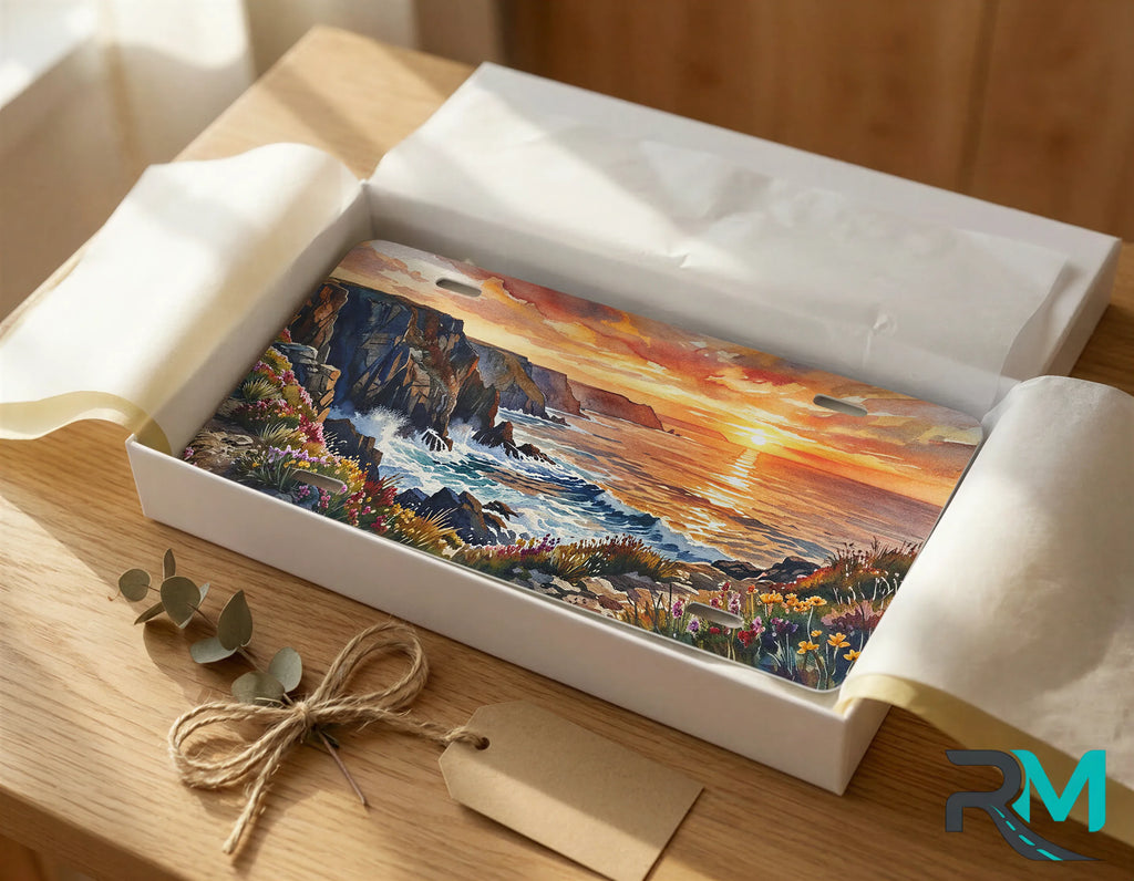 ocean sunset vanity plate as gift — coastal cliff scene license plate ready to give