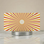 retro orange radiant vanity plate hero shot — warm peach cream golden hour sunburst art