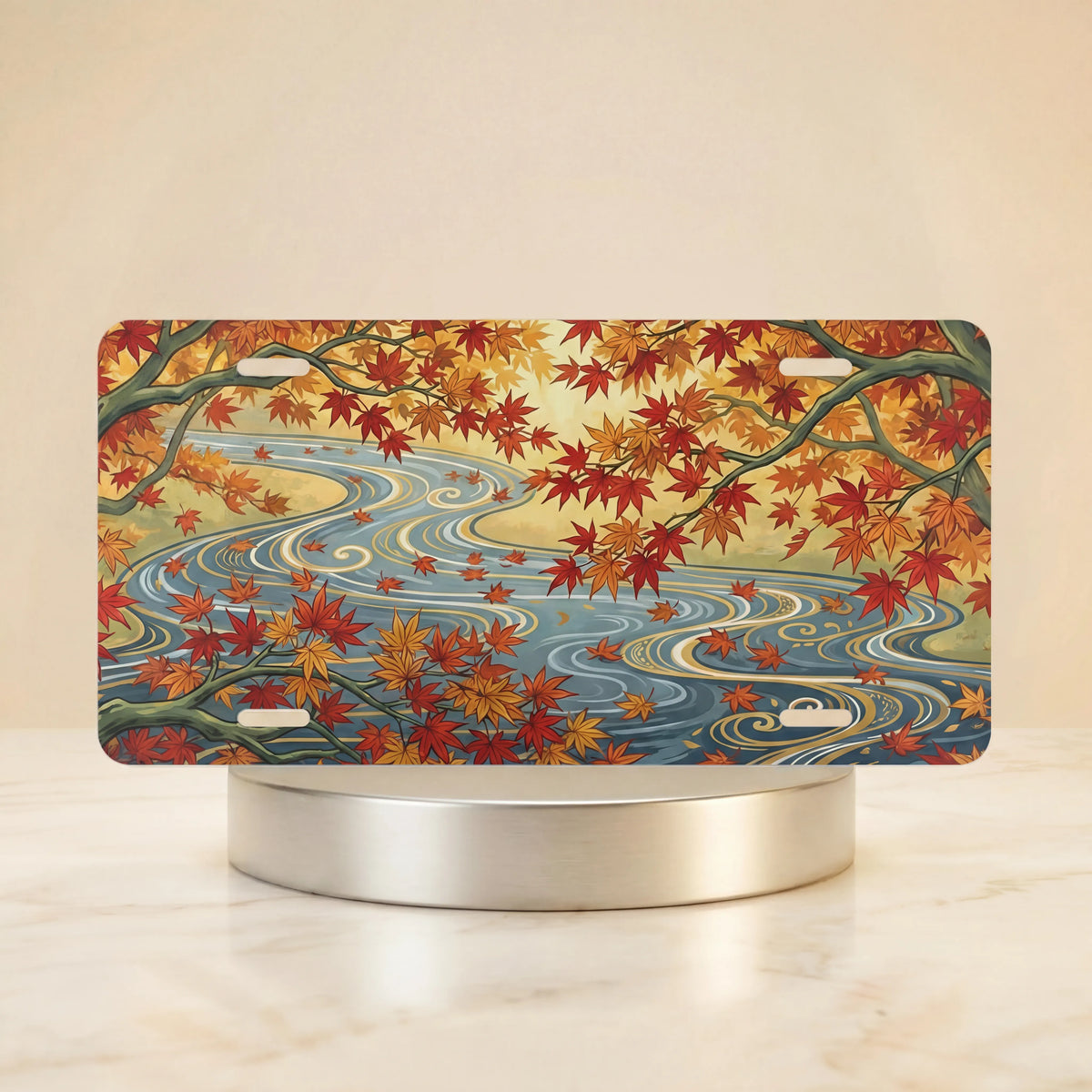 autumn maple stream vanity plate — warm orange gold maple leaves winding river soft blue license plate on holder