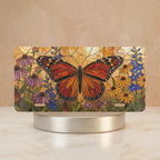 monarch floral vanity plate hero shot — vivid orange butterfly coneflowers black-eyed susans art
