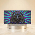 raven head vanity plate hero shot — deep sapphire violet teal bird radiant beams art
