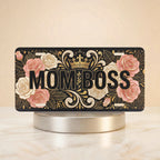 mom boss vanity plate hero shot — blush rose gold scrollwork crown art