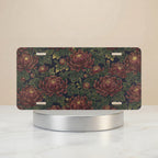 vintage floral chrysanthemum vanity plate — deep burgundy chrysanthemums lush green leaves antique botanical white license plate on holder