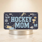 hockey mom vanity plate — deep navy hockey stick skate puck HOCKEY MOM license plate on holder