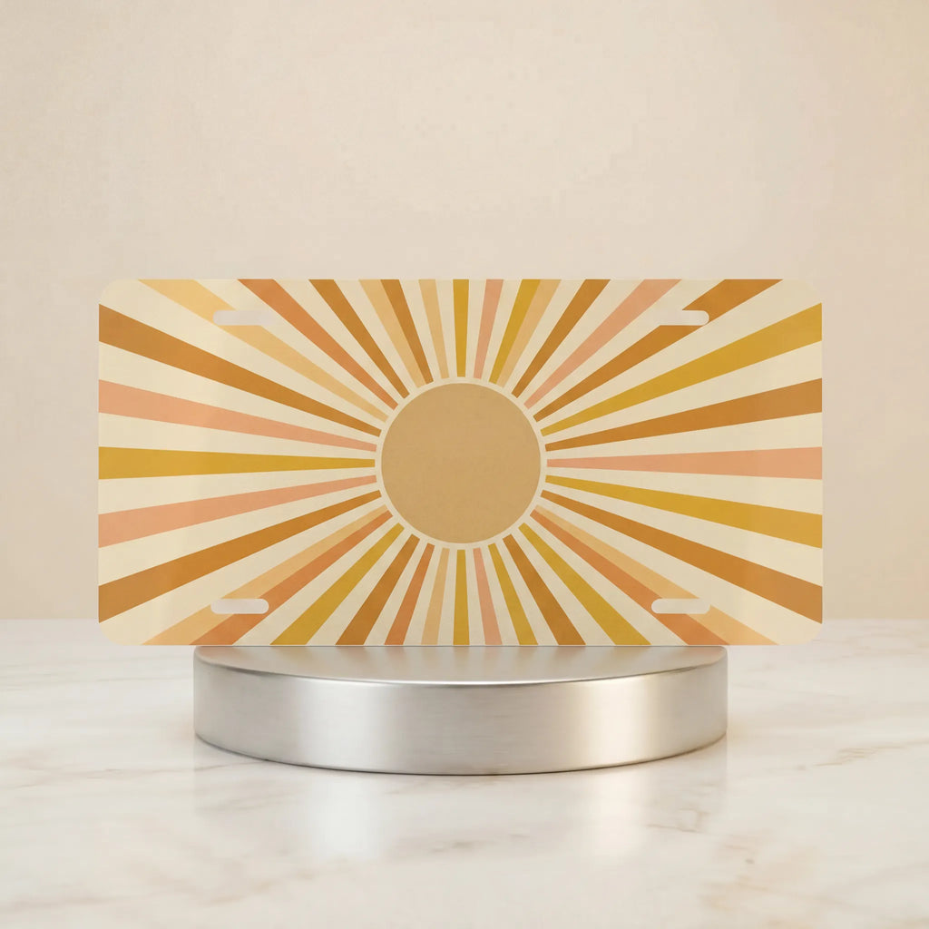 retro yellow orange vanity plate hero shot — gentle circular sunburst warm cream art