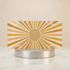 retro yellow orange vanity plate hero shot — gentle circular sunburst warm cream art