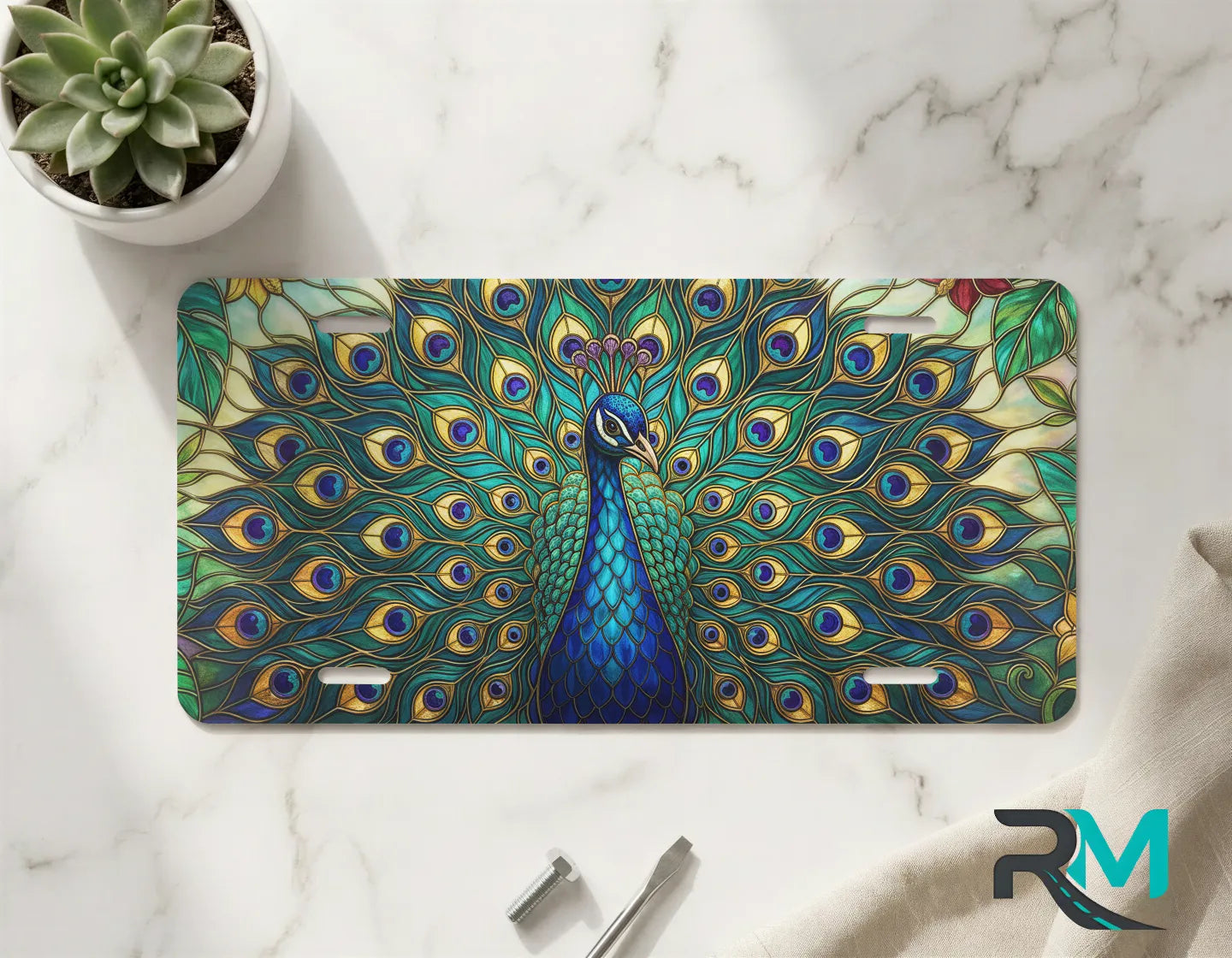 peacock feathers vanity plate on marble surface — jewel teal emerald gold decorative plate