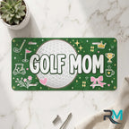 golf mom vanity plate on marble surface — deep green golf ball decorative license plate