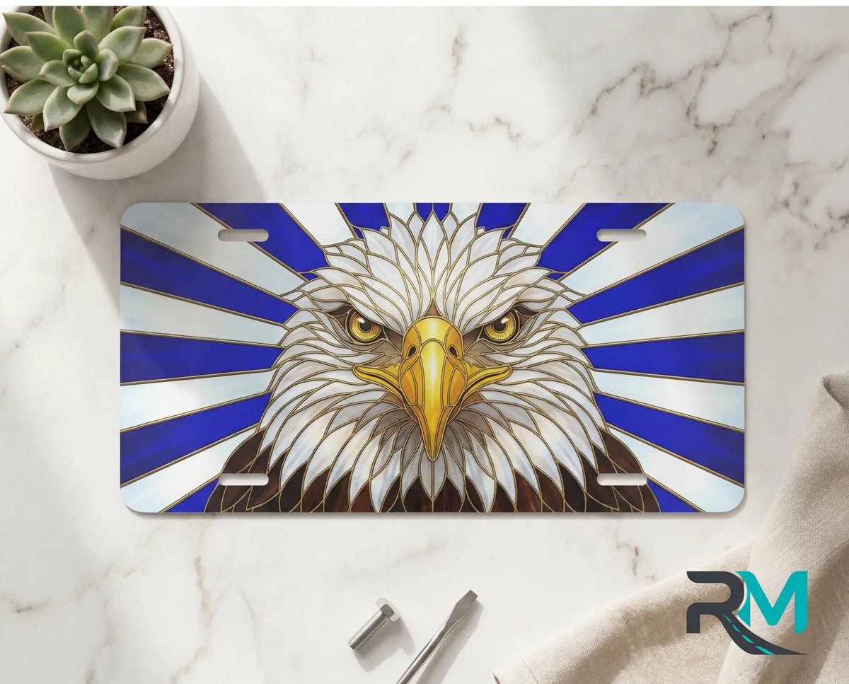 eagle head vanity plate on marble surface — deep navy white patriotic decorative license plate