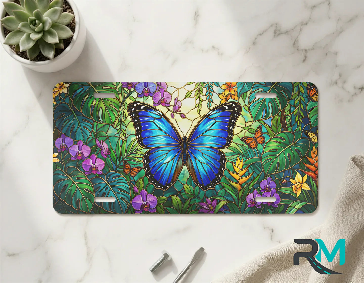 blue butterfly vanity plate on marble surface — vivid blue butterfly tropical foliage decorative plate