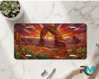 desert arch sunset vanity plate on marble surface — warm amber sandstone arch cactus decorative plate