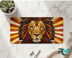 lion face vanity plate on marble surface — warm amber rust gold decorative lion plate