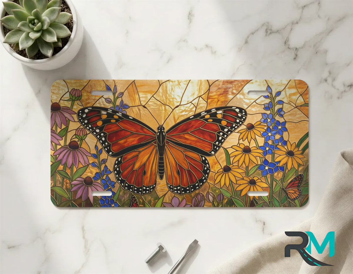 monarch butterfly floral vanity plate on marble surface — vivid orange wildflower decorative plate