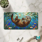 sea otter stained glass vanity plate on marble surface — jewel teal otter kelp decorative plate