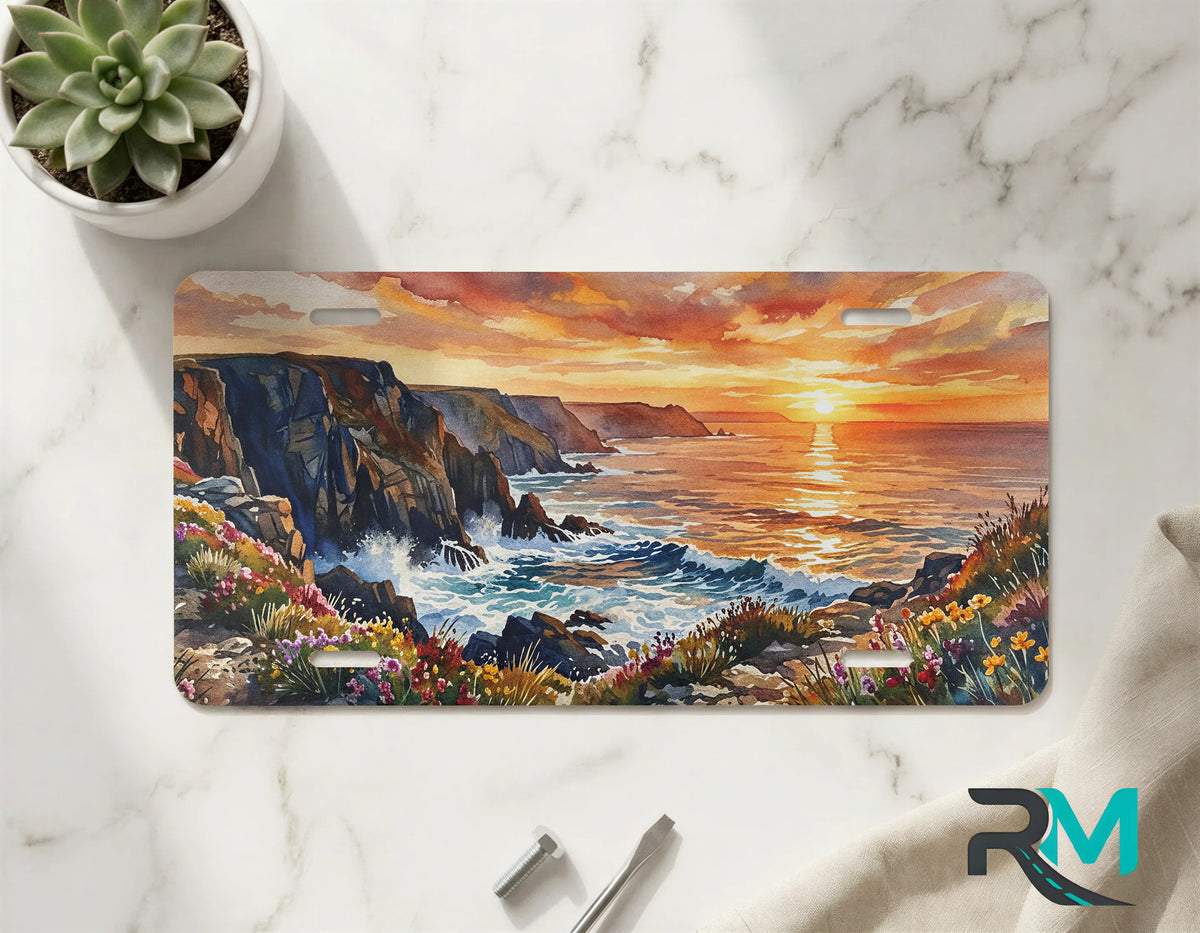 coastal cliffs front license plate on marble surface — vivid seaside sunset illustration