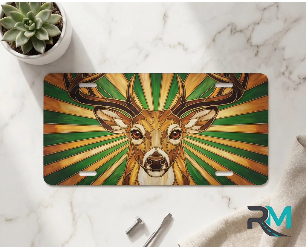 stag portrait vanity plate on marble surface — warm amber forest green decorative deer plate